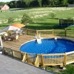 above ground pool with deck above ground pool designs with wood railing and table sets WJTFHZY