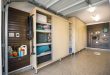 garage storage on another side of the garage is a large-sized rectangular maple melamine  cabinet with YFLINQJ