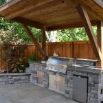 outdoor kitchen ideas rustic patio with polished concrete, outdoor kitchen, raised beds, stacked  stone, fence OSIYRYD