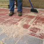 paver patio sweeping sand between pavers. EIQYQEE