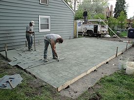 stamped concrete concrete being stamped with an ashlar slate pattern WOSLRZG