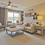 carpet designs for living room living room with medium beige frieze (twisted) carpet, flush light, ceiling  fan, EXXVKUX