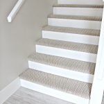 Carpet stairs stairs with carpet herringbone treads and painted white risers, looks like  a MMSJBPK