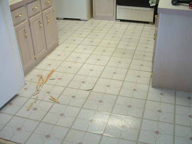 laminate floor tiles quick step laminate tile will be installed in this kitchen. this is the XMZNCHG