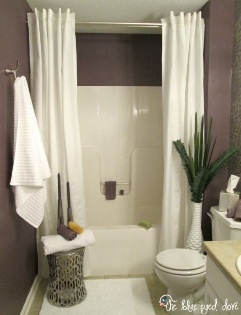 Hang a second shower curtain to make your tub seem extra luxurious