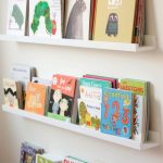 Awesome idea for books in a kid's room. The picture ledges are from