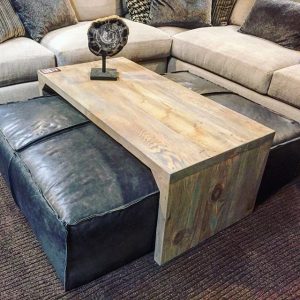 Leather ottoman/sliding wood coffee table. Super stylish and