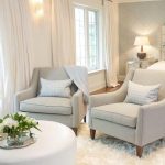 Bedroom Sitting Area with Gray Chairs and White Ottoman